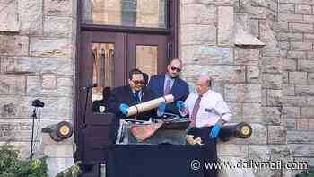 Mysterious 100-year-old time capsule is discovered and reopened at Midwest masonic temple... and its fascinating contents are immaculate