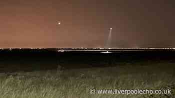 Emergency services scour Merseyside beach in hunt for two people