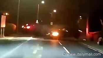 Moment family in taxi is hit on their way home from airport by reckless driver who careers round corner on wrong side of the road 