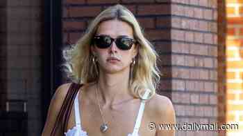 Gwyneth Paltrow's lookalike model daughter Apple Martin, 22, keeps cool in a white strappy sundress as she runs errands