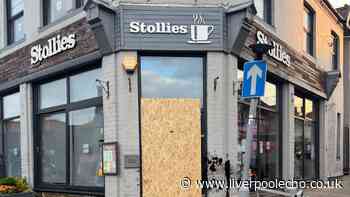 Car smashes into Wallasey café as woman arrested