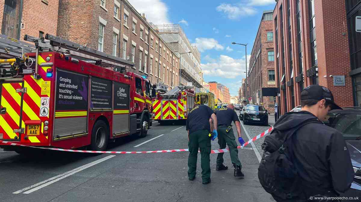 Man on Duke Street roof live updates as road closed