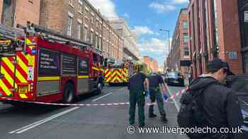 Man on Duke Street roof live updates as road closed