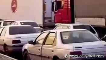 Huge queues form for petrol in Tehran after US announced 'economic asphyxiation' sanctions on Iran