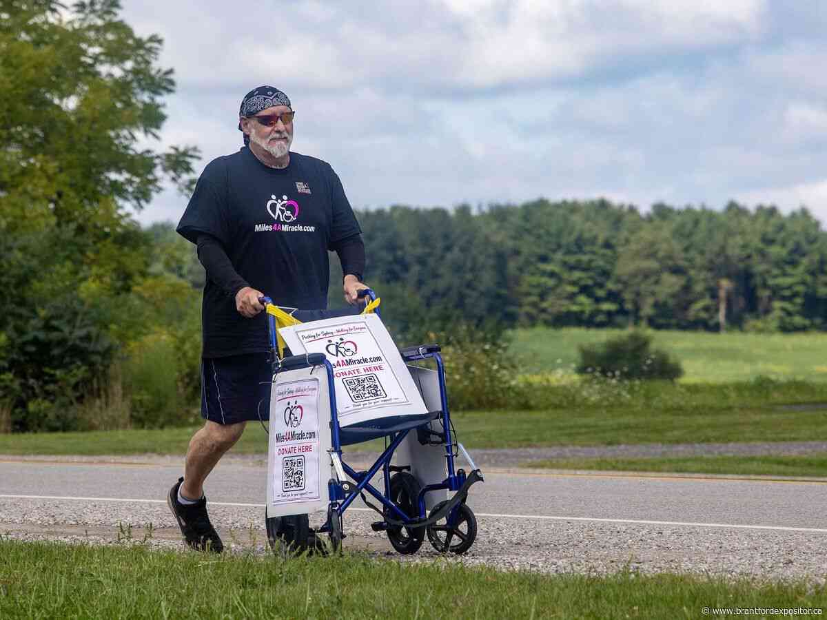 London dad pushing daughter's wheelchair 200 km in fight for $493K surgery