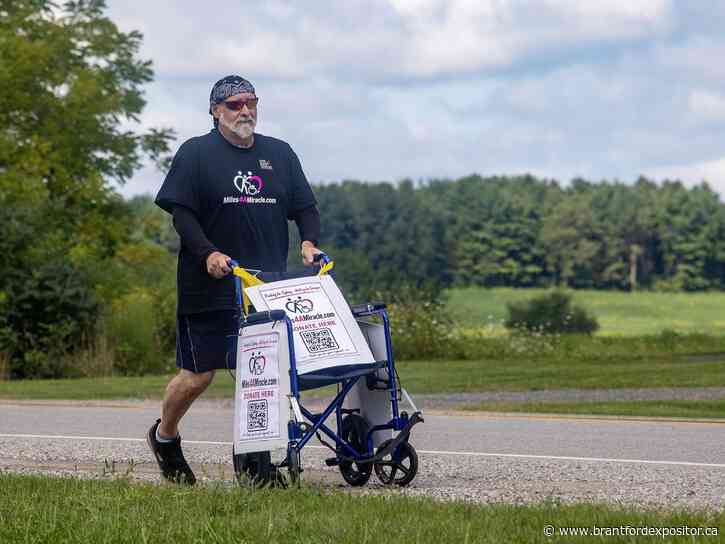 London dad pushing daughter's wheelchair 200 km in fight for $493K surgery