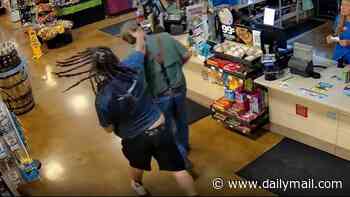 Cruel Amazon worker is filmed knocking elderly man to the ground after argument over a parking space