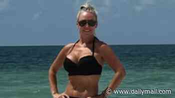 Strictly pro Kristina Rihanoff stuns in a black bikini as she hits the beach with lookalike daughter Mila, 10, on family trip to Florida