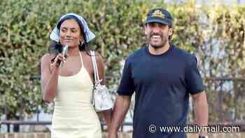 Simone Ashley looks loved-up with her new boyfriend Jay Jammal as they enjoy a dog walk in Notting Hill
