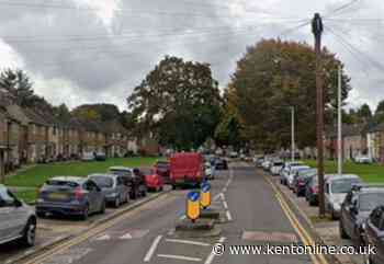 Armed officers descend on residential street where two men injured