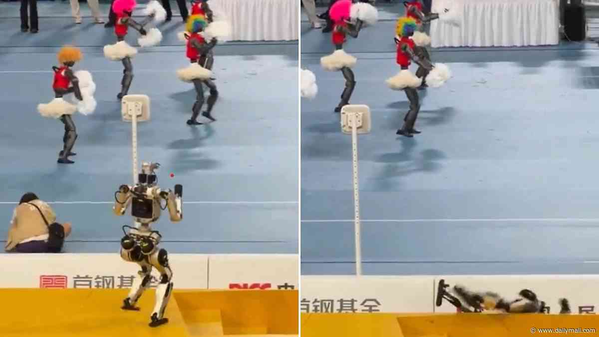 Robots, they're just like us! Watch the hilarious moment a humanoid falls down the stairs after getting distracted by a crowd of cheerleaders