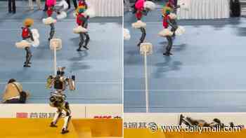 Robots, they're just like us! Watch the hilarious moment a humanoid falls down the stairs after getting distracted by a crowd of cheerleaders