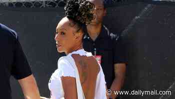 Mel B, 51, shows off her youthful glow as she returns to her Spice Girls roots with a band T-shirt and Wannabe bag