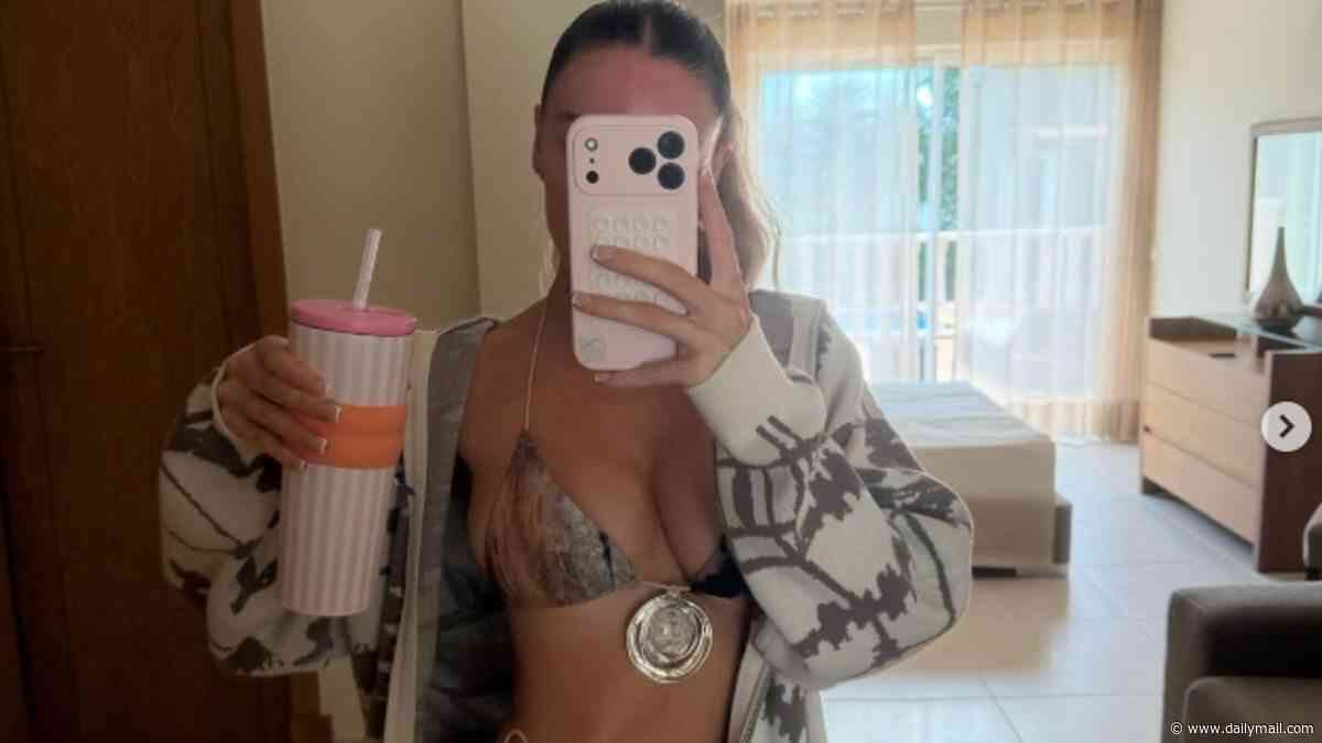 Footballer Paul Scholes' daughter shows off her scars in a bikini after she was hospitalised for mystery reason