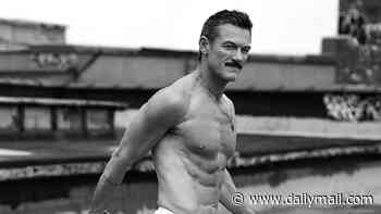 Luke Evans displays his ripped six-pack as he poses in white briefs while embracing his new 'body confidence' in sizzling cover shoot for Attitude magazine