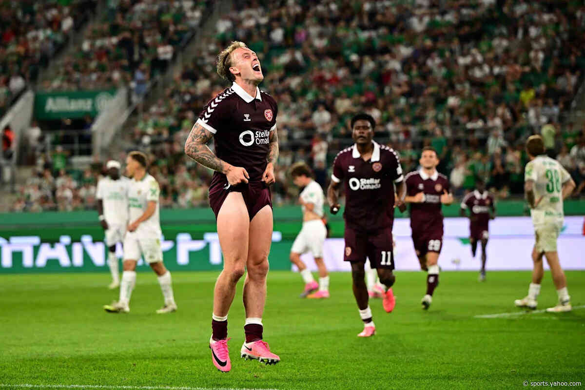 Hearts defeat Rapid Wien on penalties despite a red card to qualify for the Conference League