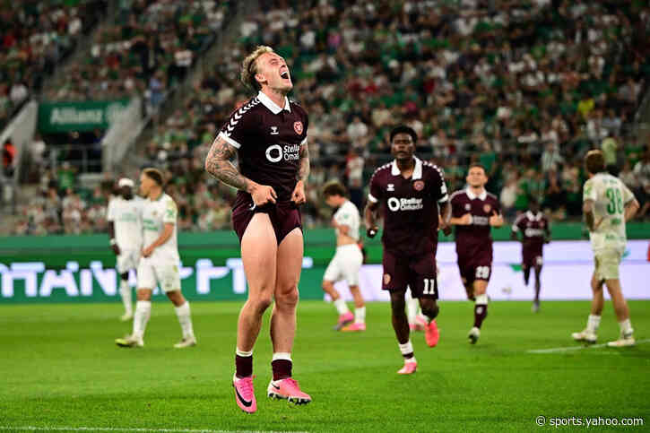 Hearts defeat Rapid Wien on penalties despite a red card to qualify for the Conference League