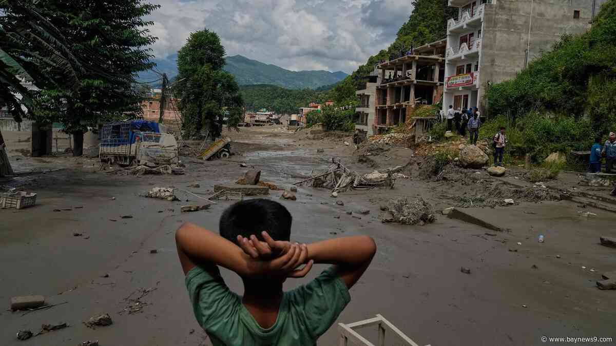 At least 160 killed and hundreds missing after flash floods in Nepal and China