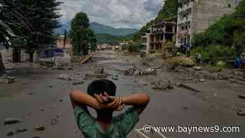At least 160 killed and hundreds missing after flash floods in Nepal and China
