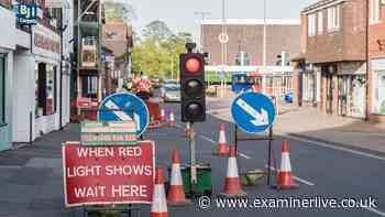 Lawyer explains what to do if temporary traffic lights won't change from red