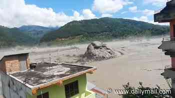 Astonishing new footage emerges from Nepal - with bus-sized 'boulder' pushed by floodwaters to last-second escapes from tsunami