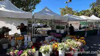 Vendors at ritzy celebrity-favorite farmer's market up in arms as their stalls selling $14 organic eggs and artisanal cheese are abruptly moved to parking lot