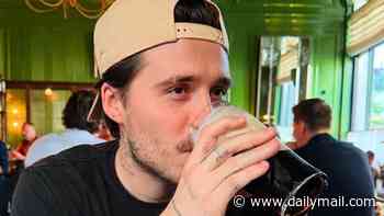 Brooklyn Beckham is accused of 'rage-baiting' Guinness drinkers and 'leaving the whole of Ireland weeping' as he shares photo of a 'badly poured' pint into the wrong glass