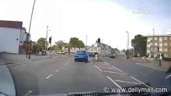 Moment Audi ploughs into car on wrong side of road in head-on crash after speeding across junction