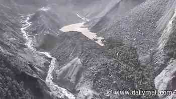 Nepal flood RECAP: Incredible footage shows workers flee wall of water as China warns second 'dam' has formed with 'high risk of breaching', sparking SECOND tsunami fears