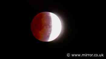 Moon turns blood red in stunning lunar eclipse as earth's shadow seen across UK