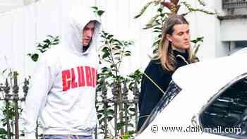 Sydney Swans player Chad Warner seen in tense outing with his stony-faced girlfriend as he breaks cover for the first time since hotel scandal with a strippers - but has a laugh with a mate just hours later