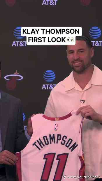 First look at Miami Heat Klay Thompson as he holds up his new jersey to start his intro presser