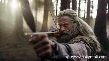 Hugh Jackman shows off his long grey hair and prosthetic beard for his bloody reimagining of Robin Hood