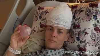 Busy Philips, 47, shares pictures of herself recovering in intensive care after having surgery to remove rare brain tumour as she reassures fans that she is 'totally fine'