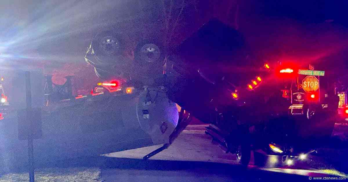 Overturned fuel tanker carrying 7,500 gallons of diesel closes DeKalb County road as crews work to contain runoff