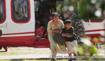 Death toll rises in Nepal-China border disaster as a lake poses new flood threat