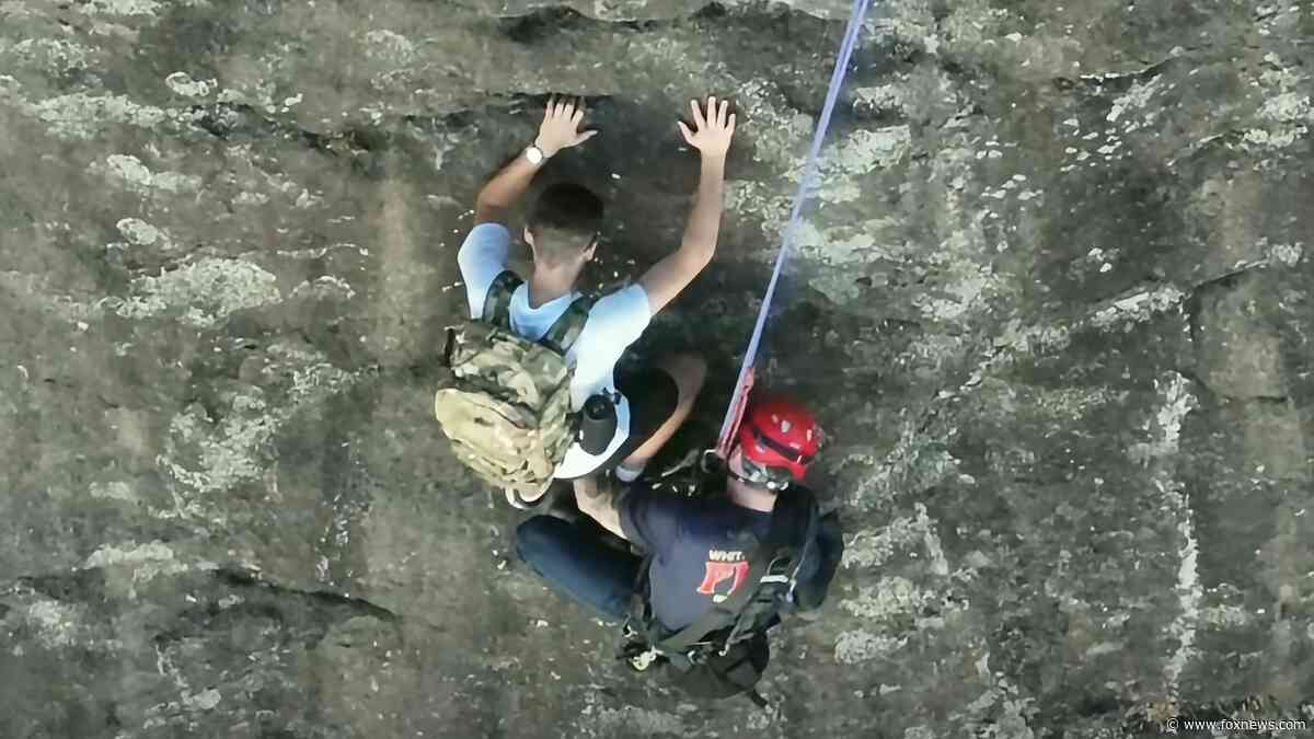 Free climber stranded on Georgia rock face calls 911, prompting dramatic rescue by firefighter
