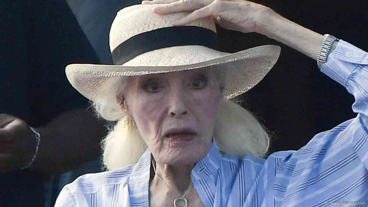 Iconic TV siren, 93, who played a 'feline devil' looks unrecognizable decades after captivating fans in a leather catsuit... can you guess who?