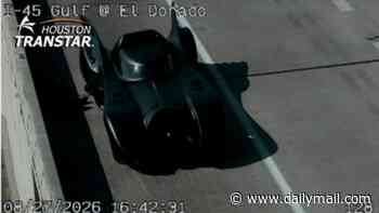 Bizarre moment BATMOBILE suffers flat tire while driving down Texas freeway