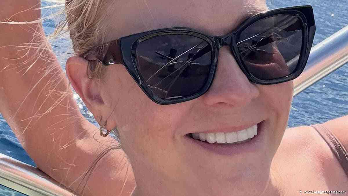 Beach-bound Melissa Joan Hart goes wild in tiny blue bikini to celebrate huge milestone