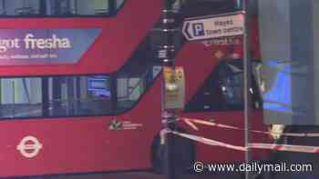 Double-decker bus crashes into building beside London station - bringing knock-on traffic and public transport disruption
