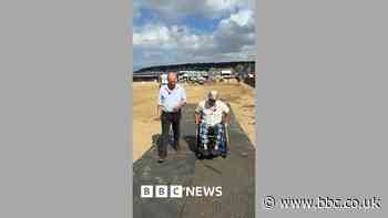 Mats laid on beach to help people with disabilities