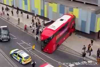 Pedestrian injured as double decker bus crashes into building in busy London high street