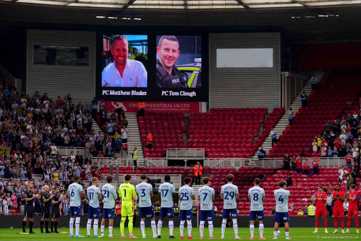 Football fans pay respects to officers killed in A66 crash