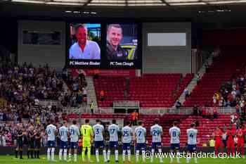 Football fans pay respects to officers killed in A66 crash