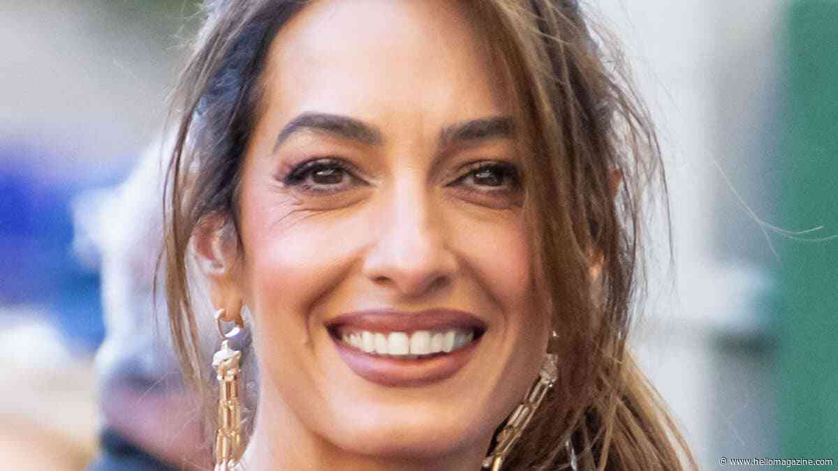 Amal Clooney stuns in bridal-inspired slinky dress in Lake Como with George