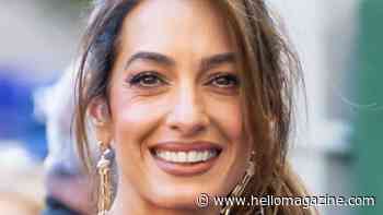 Amal Clooney stuns in bridal-inspired slinky dress in Lake Como with George