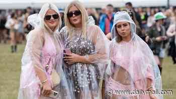 Festivalgoers brave the rain as Met Office issues new weather warning for thunderstorms and heavy showers