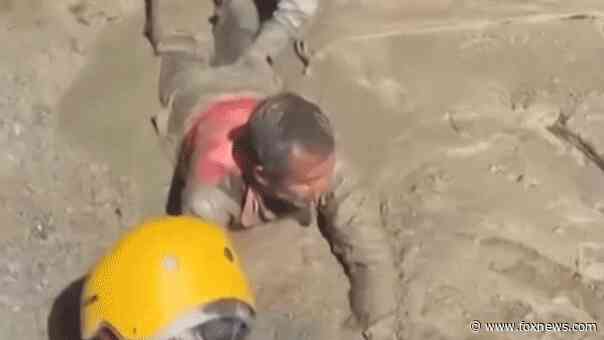 Trapped Nepali workers pulled from hydropower tunnel after catastrophic flooding