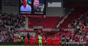 Football fans pay tribute to two officers killed in crash